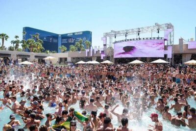 Vegas Pool Party Crawl by Party Bus w/ EZ Entry & Free Drinks - The Party Bus Stretch: Cocktails, AC, and a Strip Ride